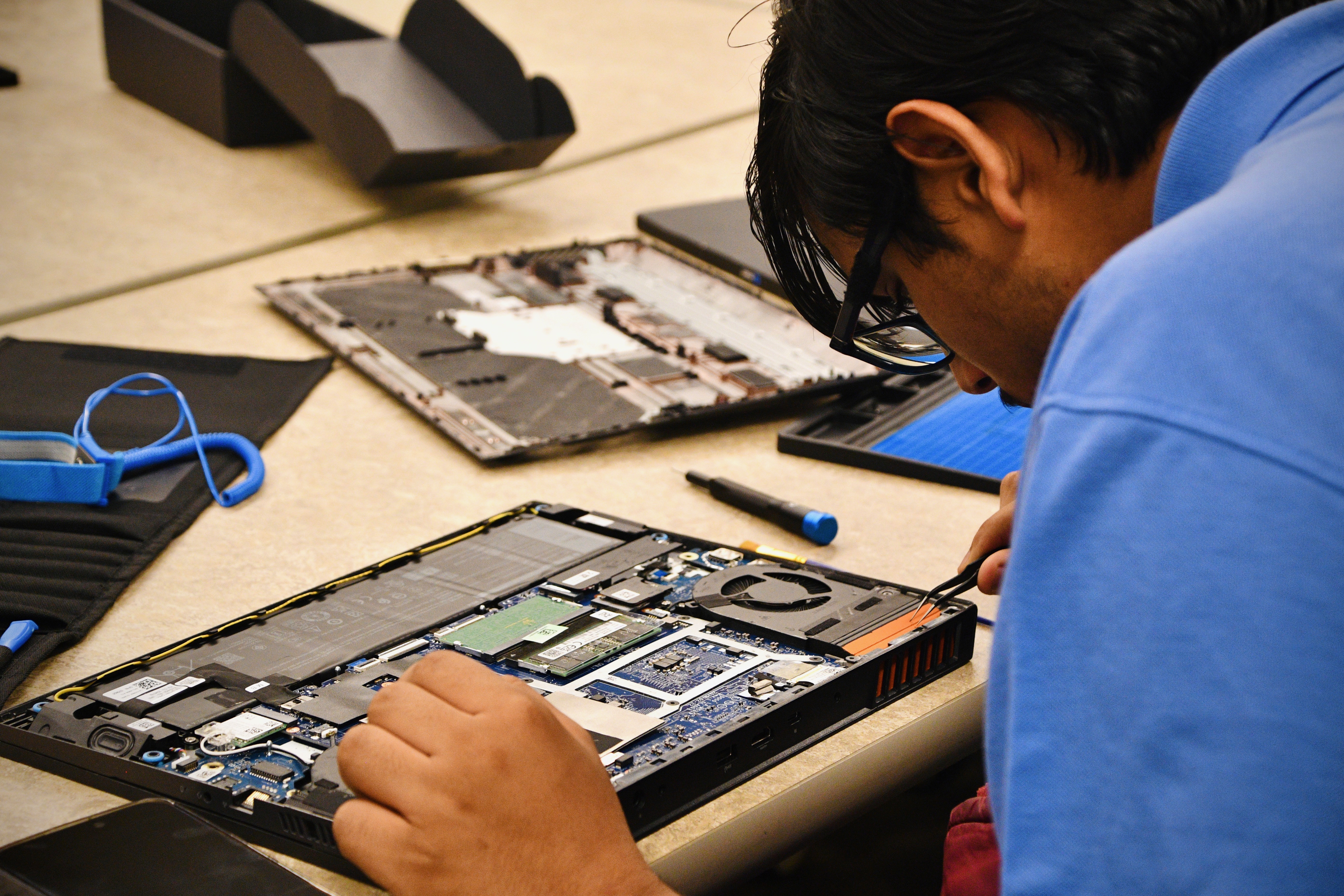 Devices staged on mats across the table